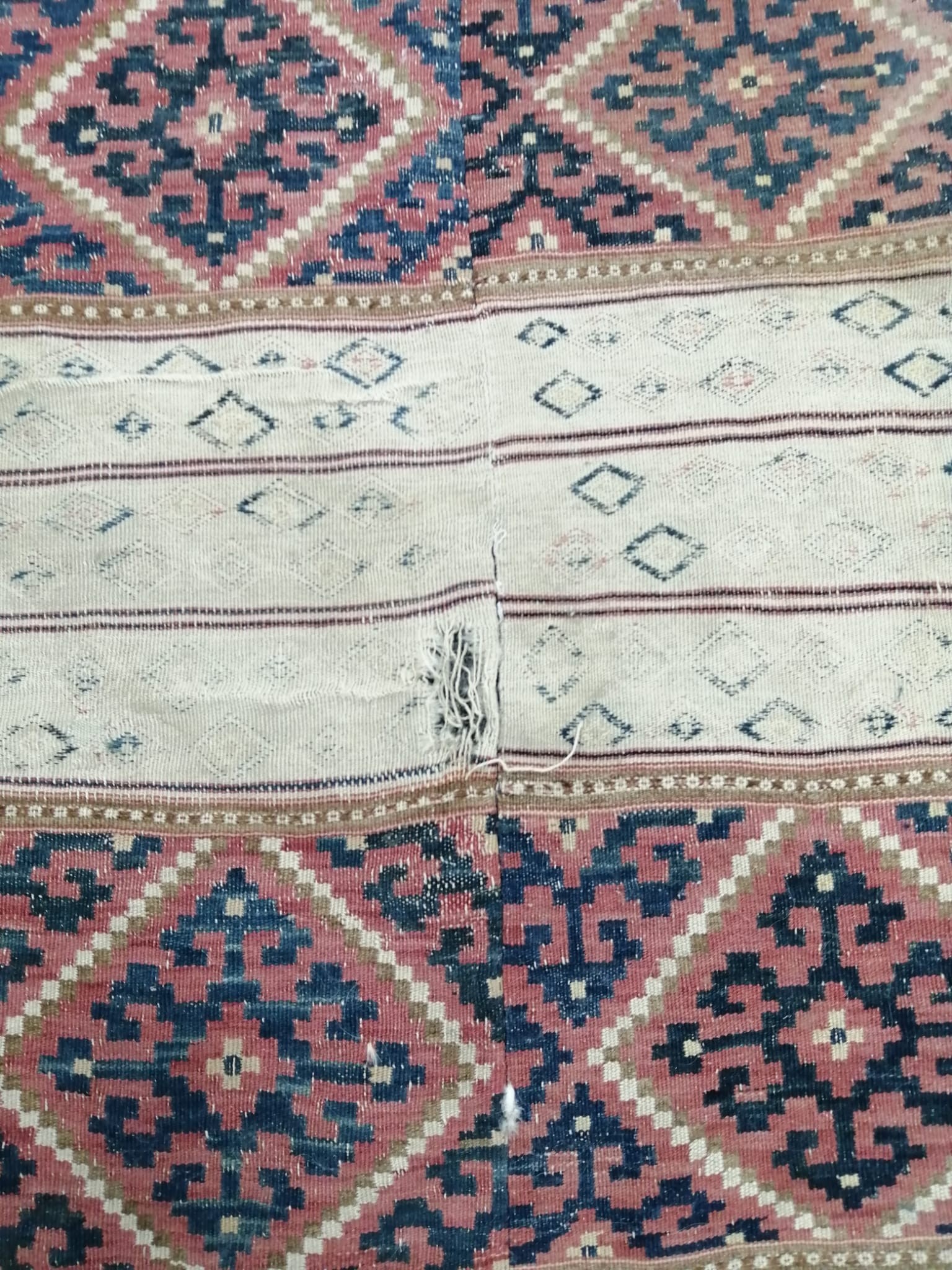 A Kelim flatweave carpet, centrally re-stitched, 385 x 150cm